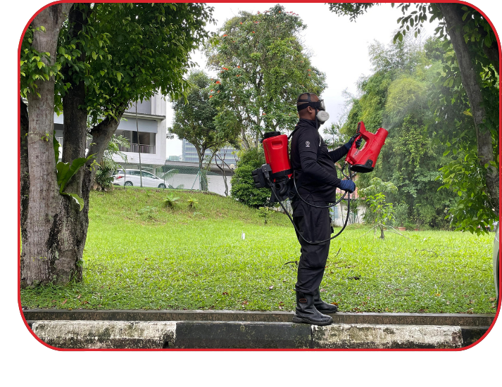 Pest control technician performing outdoor treatment as part of integrated pest management